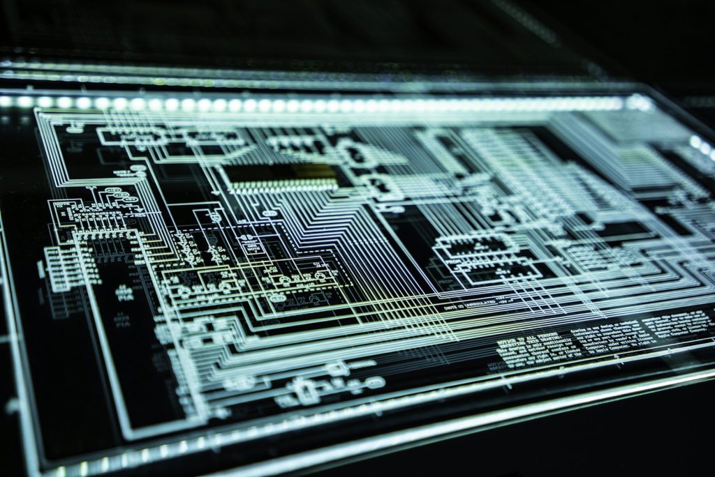 Illuminated circuit board representing layered cybersecurity